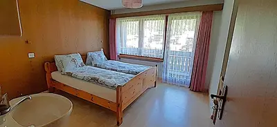Ein Bett oder Betten in einem Zimmer der Unterkunft FREE Bus Winter Haus Loree