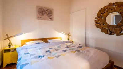 Ein Bett oder Betten in einem Zimmer der Unterkunft O Rendez Vous maison mitoyenne Piscine chauffée mars-octobre