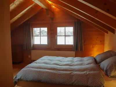 Ein Bett oder Betten in einem Zimmer der Unterkunft Apartment Lischenhaus 2 - Wohnung Flösch by Interhome