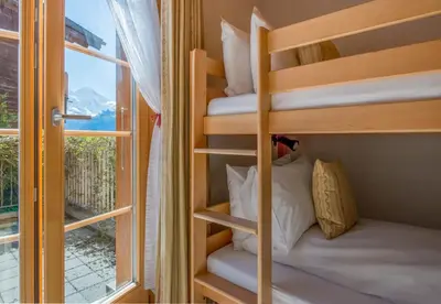 Ein Bett oder Betten in einem Zimmer der Unterkunft Chalet Sterndolde