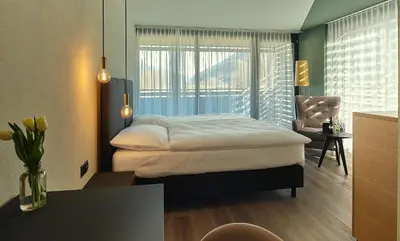 Ein Bett oder Betten in einem Zimmer der Unterkunft Links Leuk Golfresort