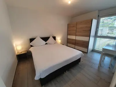 Ein Bett oder Betten in einem Zimmer der Unterkunft The Blackbird (Le Merle)