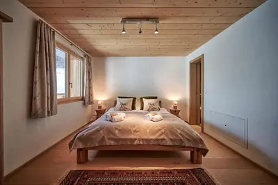 Ein Bett oder Betten in einem Zimmer der Unterkunft Chalet Bärgsunna Penthouse