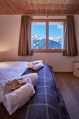 Ein Bett oder Betten in einem Zimmer der Unterkunft Chalet Bärgsunna Penthouse