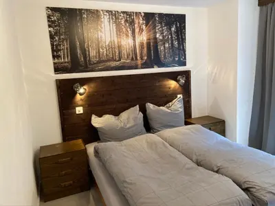 Ein Bett oder Betten in einem Zimmer der Unterkunft Ferienwohnung ViOs im Haus Castello