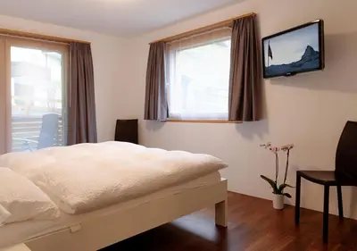 Ein Bett oder Betten in einem Zimmer der Unterkunft Apartment Superior Parrot