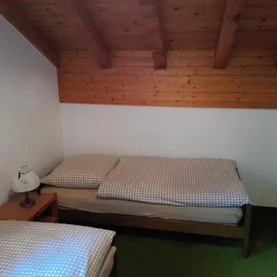 Ein Bett oder Betten in einem Zimmer der Unterkunft Chalet-Schümli Maisonette