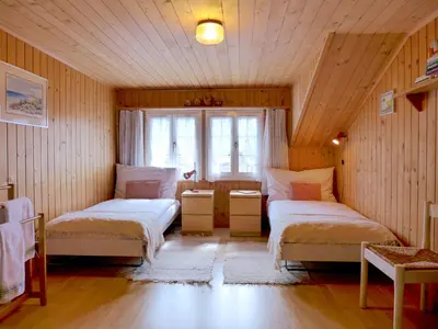 Ein Bett oder Betten in einem Zimmer der Unterkunft Holiday Home Chalet Esther by Interhome