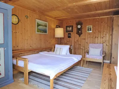 Ein Bett oder Betten in einem Zimmer der Unterkunft Holiday Home Chalet Esther by Interhome
