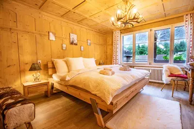 Ein Bett oder Betten in einem Zimmer der Unterkunft Wasserfallhüsli in Lauterbrunnen, near Interlaken, Mürren, Wengen