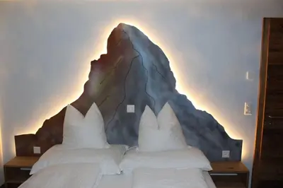 Ein Bett oder Betten in einem Zimmer der Unterkunft Matterhorn 2.5 Zimmerwohnung