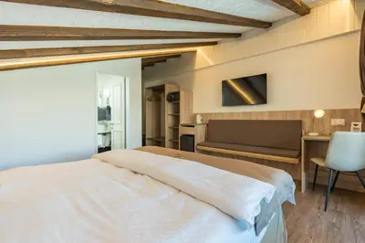 Ein Bett oder Betten in einem Zimmer der Unterkunft Hotel Beau Rivage