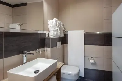 Ein Badezimmer in der Unterkunft Hotel Beau Rivage