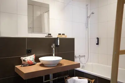 Ein Badezimmer in der Unterkunft The HEY HOTEL