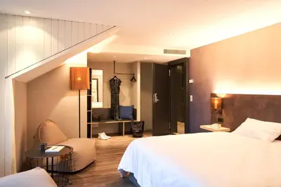 Ein Bett oder Betten in einem Zimmer der Unterkunft The HEY HOTEL