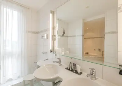 Ein Badezimmer in der Unterkunft Hotel Metropole Interlaken