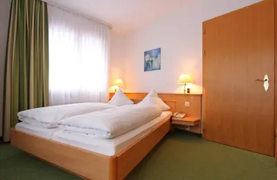 Ein Bett oder Betten in einem Zimmer der Unterkunft Bernerhof Swiss Quality Hotel