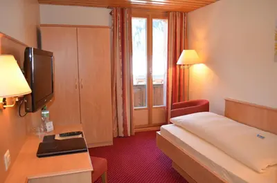 Ein Bett oder Betten in einem Zimmer der Unterkunft Bernerhof Swiss Quality Hotel