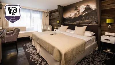 Ein Bett oder Betten in einem Zimmer der Unterkunft Wellness Hotel Alpenhof