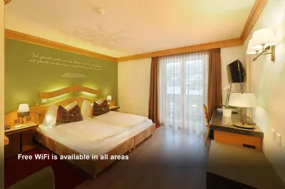 Ein Bett oder Betten in einem Zimmer der Unterkunft Hotel Kirchbühl Superior
