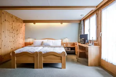 Ein Bett oder Betten in einem Zimmer der Unterkunft Hotel Alpfrieden