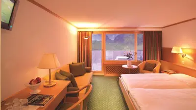 Ein Bett oder Betten in einem Zimmer der Unterkunft Hotel Metropol & Spa Zermatt