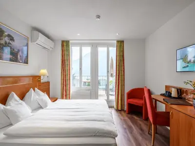 Ein Bett oder Betten in einem Zimmer der Unterkunft Hotel Seeburg - Adults only