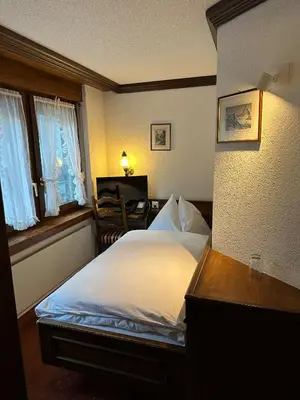 Ein Bett oder Betten in einem Zimmer der Unterkunft Hotel Astoria