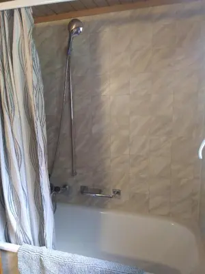Ein Badezimmer in der Unterkunft Ferien Cottage Flüehblüemli