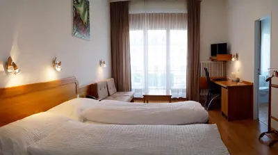 Ein Bett oder Betten in einem Zimmer der Unterkunft Hotel Victoria
