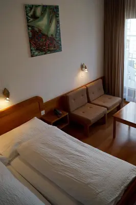 Ein Bett oder Betten in einem Zimmer der Unterkunft Hotel Victoria