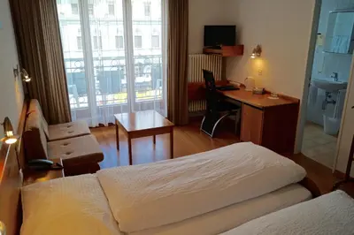 Ein Bett oder Betten in einem Zimmer der Unterkunft Hotel Victoria