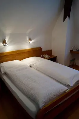 Ein Bett oder Betten in einem Zimmer der Unterkunft Hotel Victoria