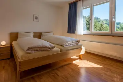 Ein Bett oder Betten in einem Zimmer der Unterkunft Golfhotel Riederhof