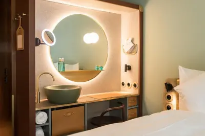 Ein Bett oder Betten in einem Zimmer der Unterkunft Hotel Aare Thun