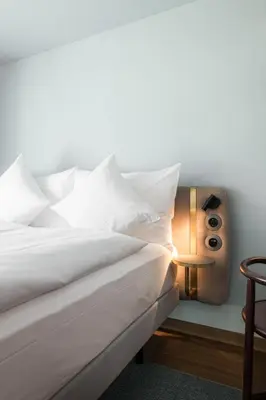 Ein Bett oder Betten in einem Zimmer der Unterkunft Hotel Aare Thun