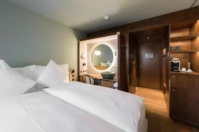 Ein Bett oder Betten in einem Zimmer der Unterkunft Hotel Aare Thun