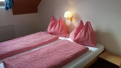 Ein Bett oder Betten in einem Zimmer der Unterkunft Berggasthaus Tannalp