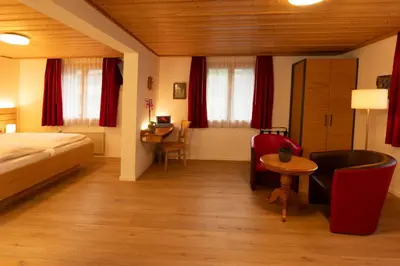 Ein Bett oder Betten in einem Zimmer der Unterkunft Hotel Hirschen - Grindelwald