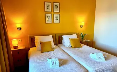 Ein Bett oder Betten in einem Zimmer der Unterkunft Hôtel de la Forêt