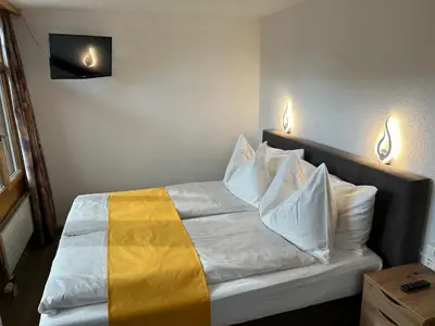 Ein Bett oder Betten in einem Zimmer der Unterkunft Post Hotel Vista