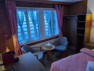 Ein Bett oder Betten in einem Zimmer der Unterkunft Hotel Schützen Lauterbrunnen