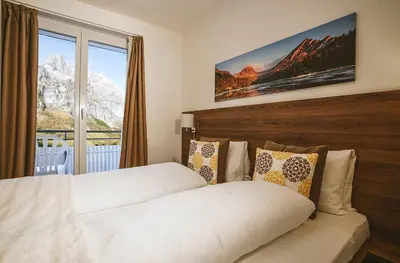 Ein Bett oder Betten in einem Zimmer der Unterkunft Hotel Römerhof