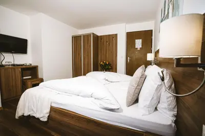 Ein Bett oder Betten in einem Zimmer der Unterkunft Hotel Römerhof