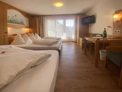 Ein Bett oder Betten in einem Zimmer der Unterkunft Hotel Restaurant Mattmarkblick