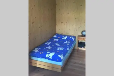 Ein Bett oder Betten in einem Zimmer der Unterkunft Idyllisches Chalet inmitten der Walliser Bergwelt