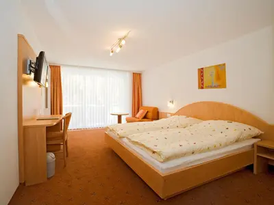 Ein Bett oder Betten in einem Zimmer der Unterkunft Hotel Monte-Moro