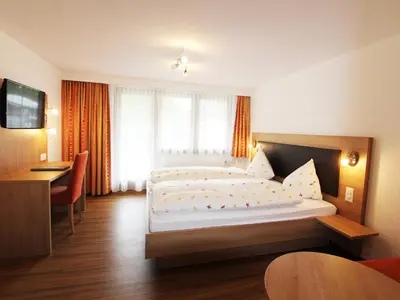 Ein Bett oder Betten in einem Zimmer der Unterkunft Hotel Monte-Moro