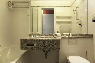 Ein Badezimmer in der Unterkunft Apartment Enzian mit Mitbenutzung SPA & Wellness - GRIWA RENT AG