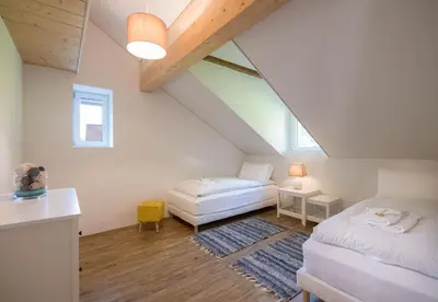 Ein Bett oder Betten in einem Zimmer der Unterkunft Le Manoir Penthouse